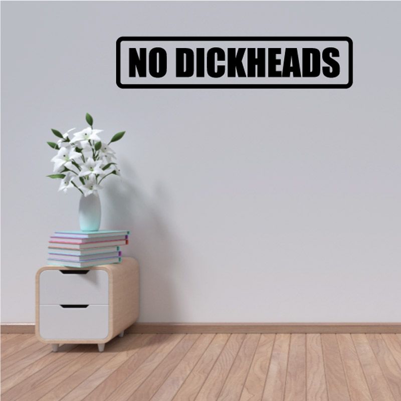 Wall decal with bold black “NO DICKHEADS” text in rounded rectangular border