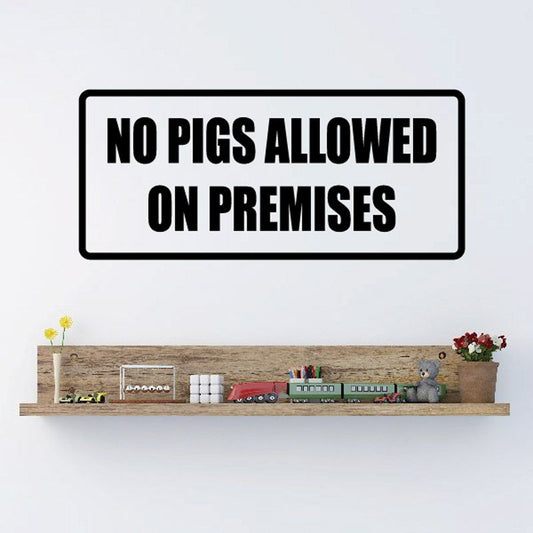 No pigs allowed on premises decal, bold black text on white background