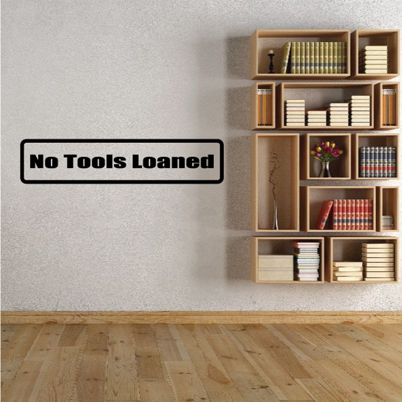 No Tools Loaned black wall decal with white text