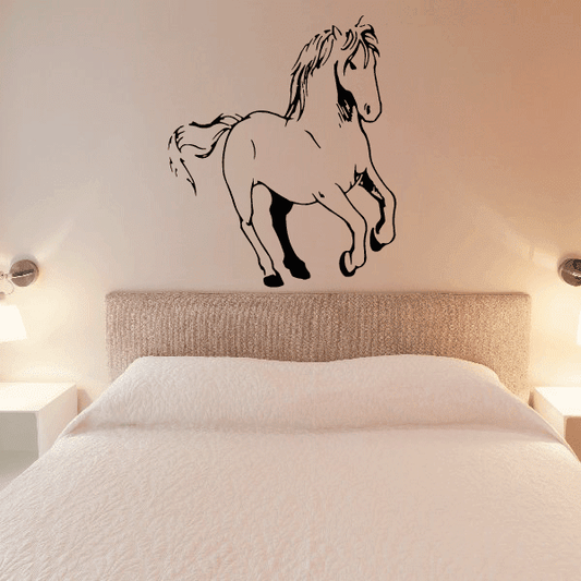 Striding horse decal in black line art, mounted on wall above a bed