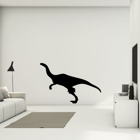 Black dinosaur wall decal silhouette with long neck and tail