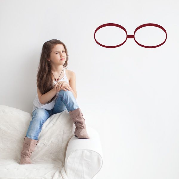 Oval glasses decal with red frames and an arched bridge bar