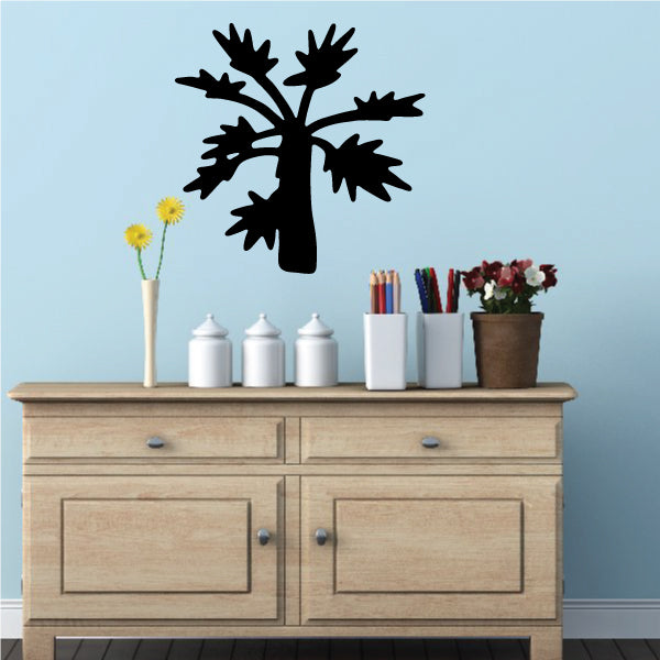 Wall embellished with a Palm Tree Decal featuring lush leaves