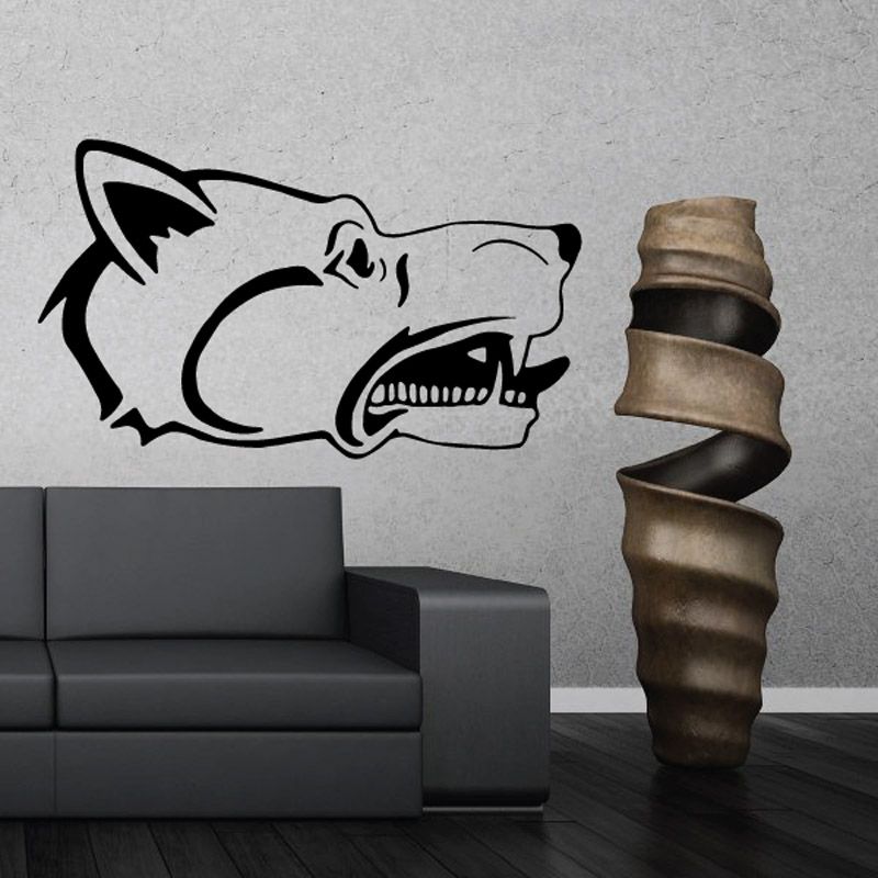 Stylized wolf head decal: black outline with snarling teeth and open mouth.