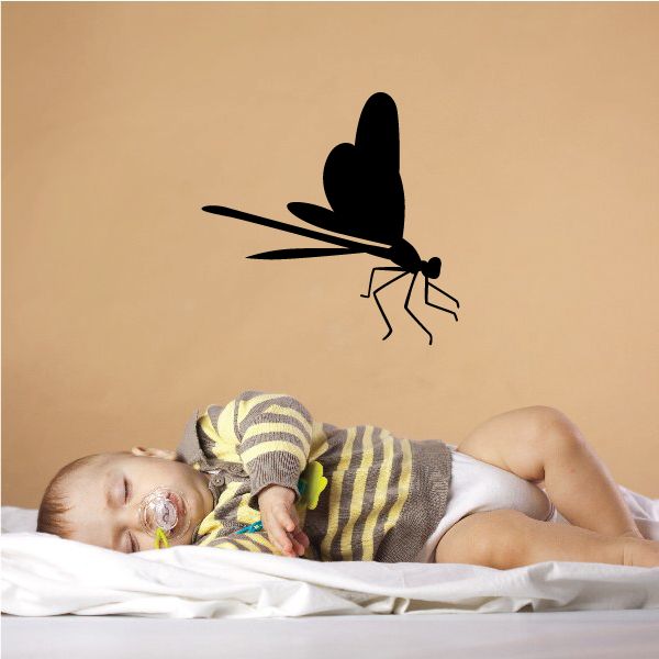 Black dragonfly wall decal with wings open and perched legs
