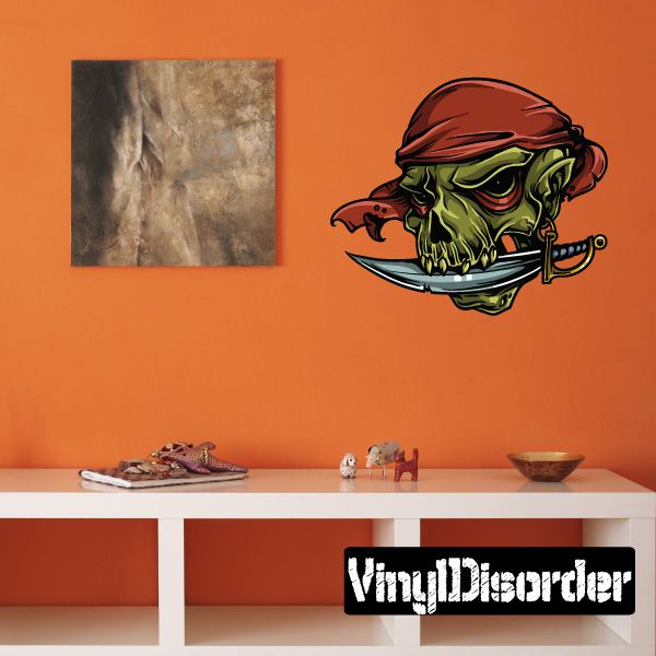 Pirate skull and dagger sticker, green skeleton with red bandana and crossed blades