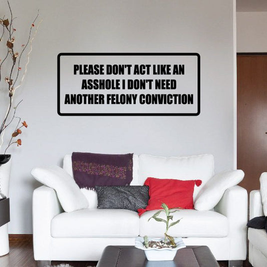 Black-bordered wall decal with bold uppercase text on a white rectangle.