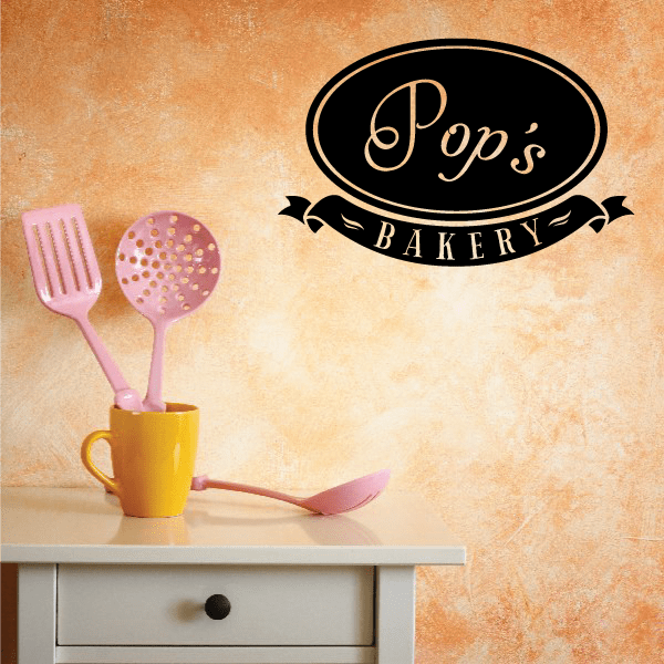 Pop's Bakery wall decal set with oval logo and ribbon banner plus fork, spoon, donut icons