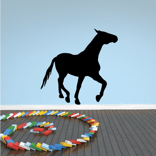 Black prancing horse silhouette decal with legs and tail extended