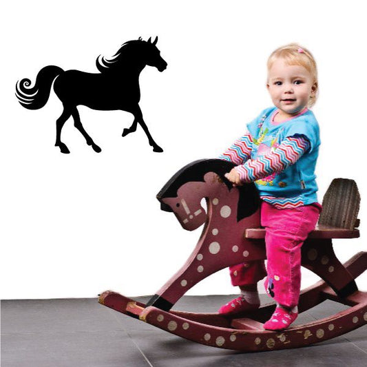 Black pony silhouette wall decal with swirling mane and tail