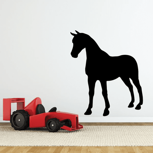 Standing horse decal with black silhouette on a smooth background