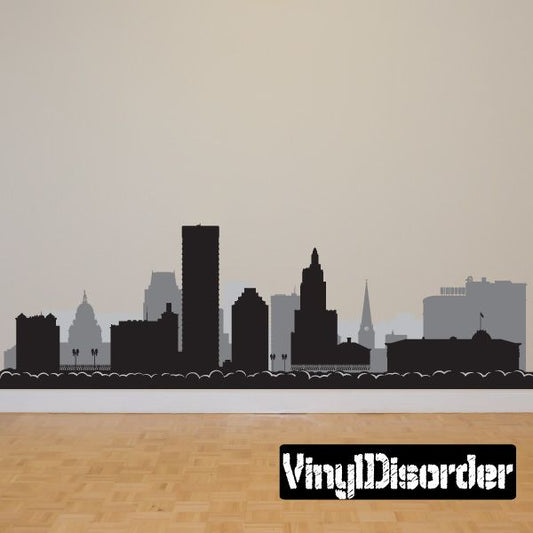 City skyline wall decal with dark building silhouette and wave border