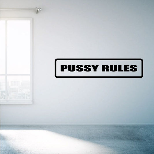 Vinyl wall decal with “PUSSY RULES” text in black on a white rectangular badge