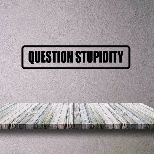 Question Stupidity decal with bold black outlined text on a light background