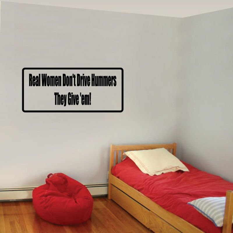 Wall decal: black quote text in white rectangle, “Real Women Don’t Drive Hummers”