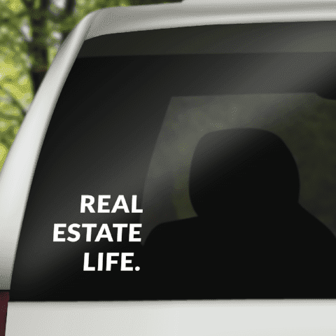 Real Estate Life vinyl decal with bold white text on dark surface