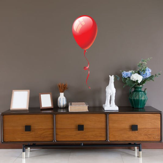 Red balloon sticker with shiny red balloon and hanging strings