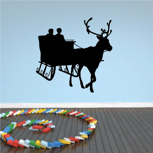 Reindeer pulling cart wall decal with deer silhouette and cart silhouette