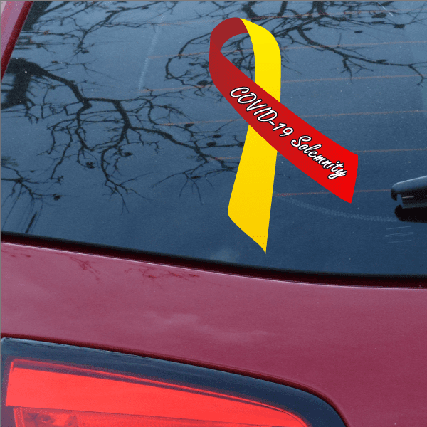 COVID-19 solemnity ribbon with red and yellow loops, text printed on ribbon