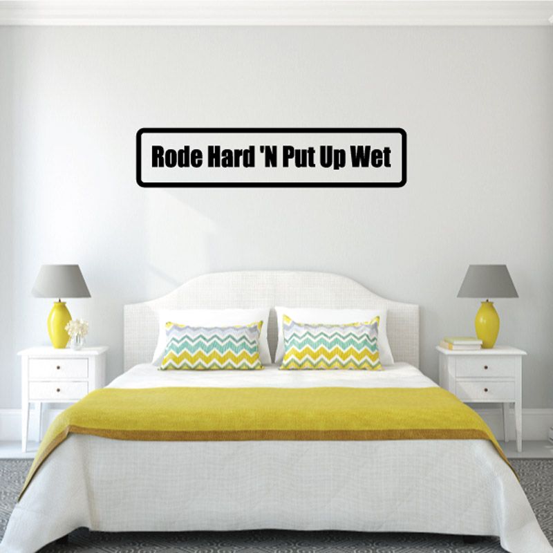 Rectangular black decal with white text: “Rode Hard 'N Put Up Wet”