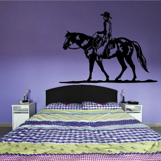 Cowboy riding horse wall decal, black silhouette with shadow on surface