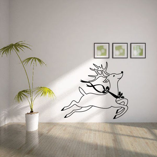 Black reindeer silhouette wall decal with antlers and nose