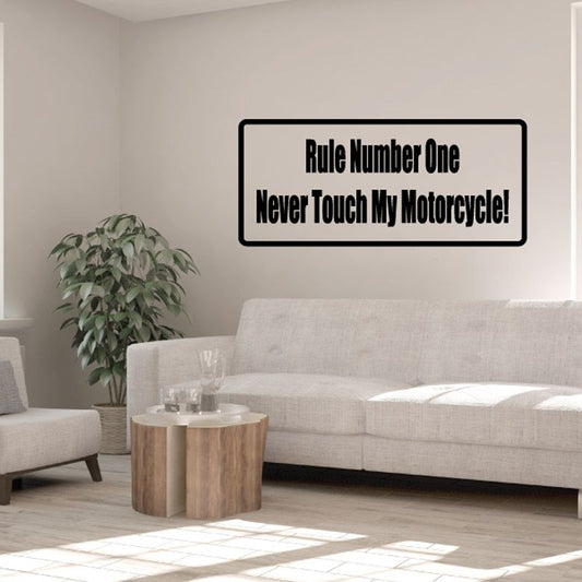 Motorcycle decal: black-bordered sign reading “Rule Number One” and “Never Touch My Motorcycle!”