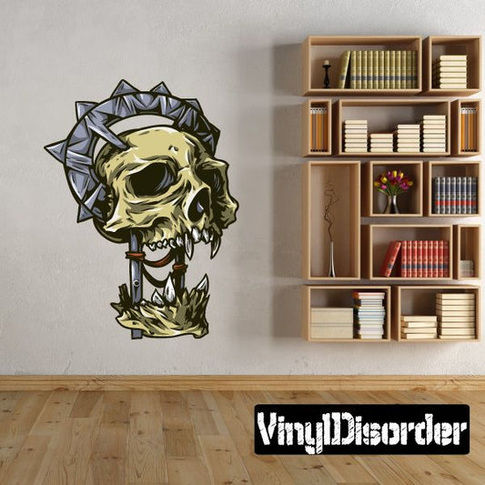 Skull totem sticker with green skull and spiked halo, small dagger design