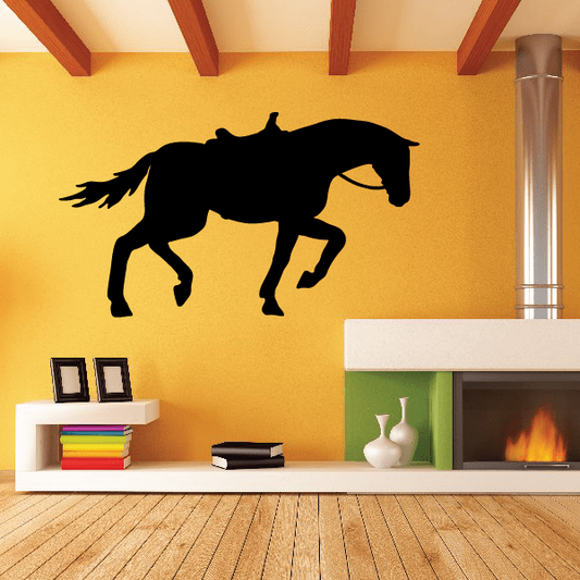 Saddled horse pulling wall decal, black silhouette on transparent background