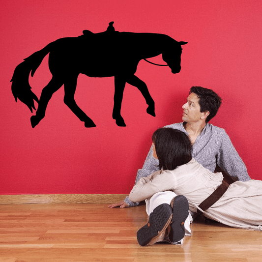 Black trotting horse decal with saddle silhouette, side view