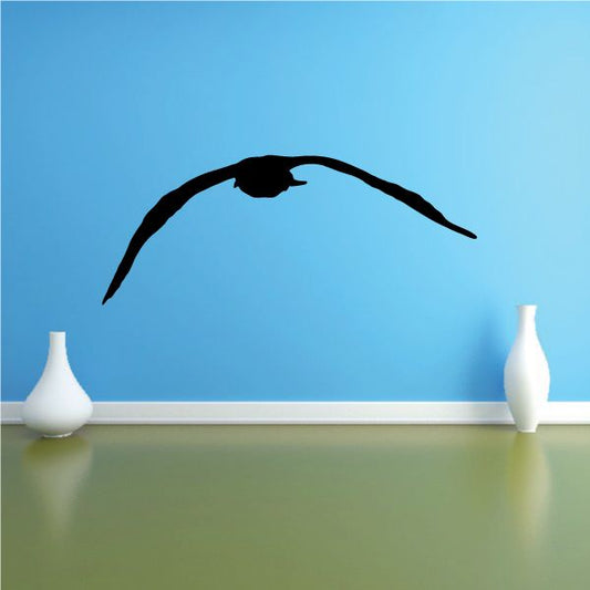 Black seagull decal with downward flap wings