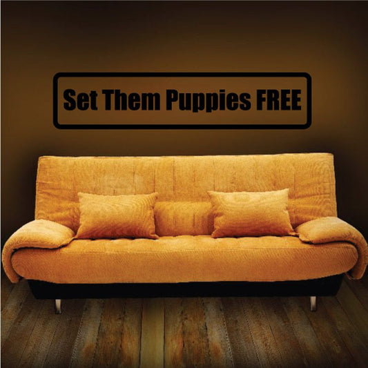 Wall decal with black border reading “Set them Puppies FREE”