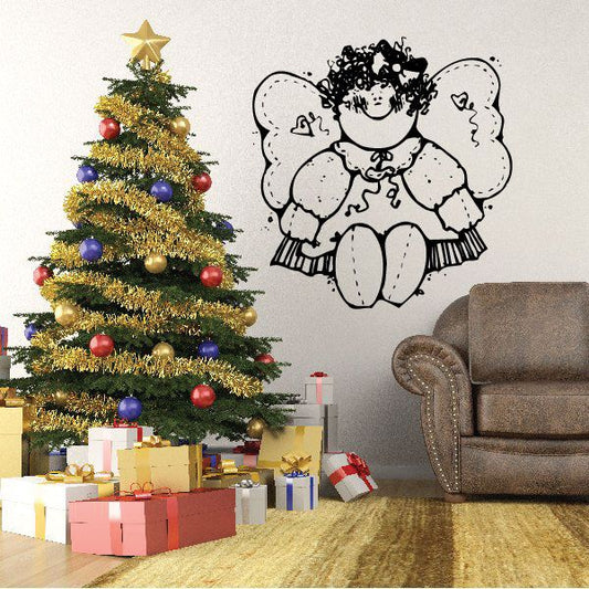 Vinyl wall decal of a white angel with curly hair and wings, sitting