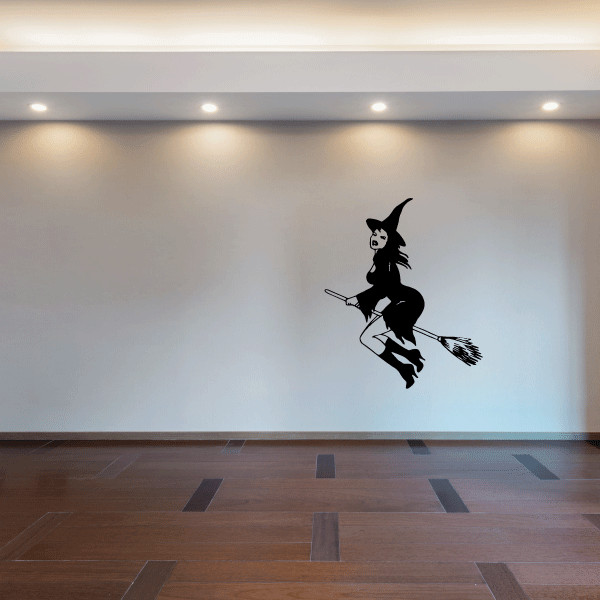 Flying witch decal: black silhouette of a witch riding a broom