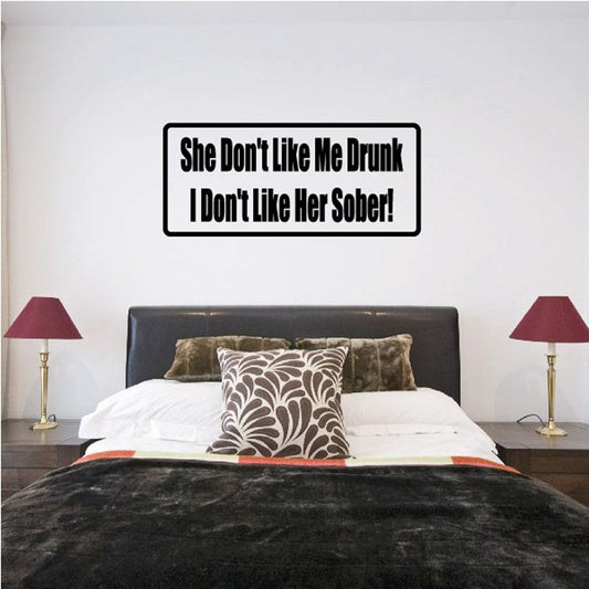 Wall decal with black border and bold white quote text on a rectangular sign