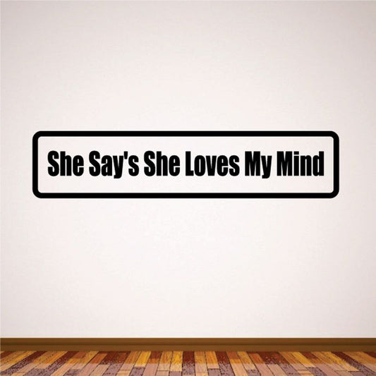 Black and white wall decal with text 'She Says She Loves My Mind'
