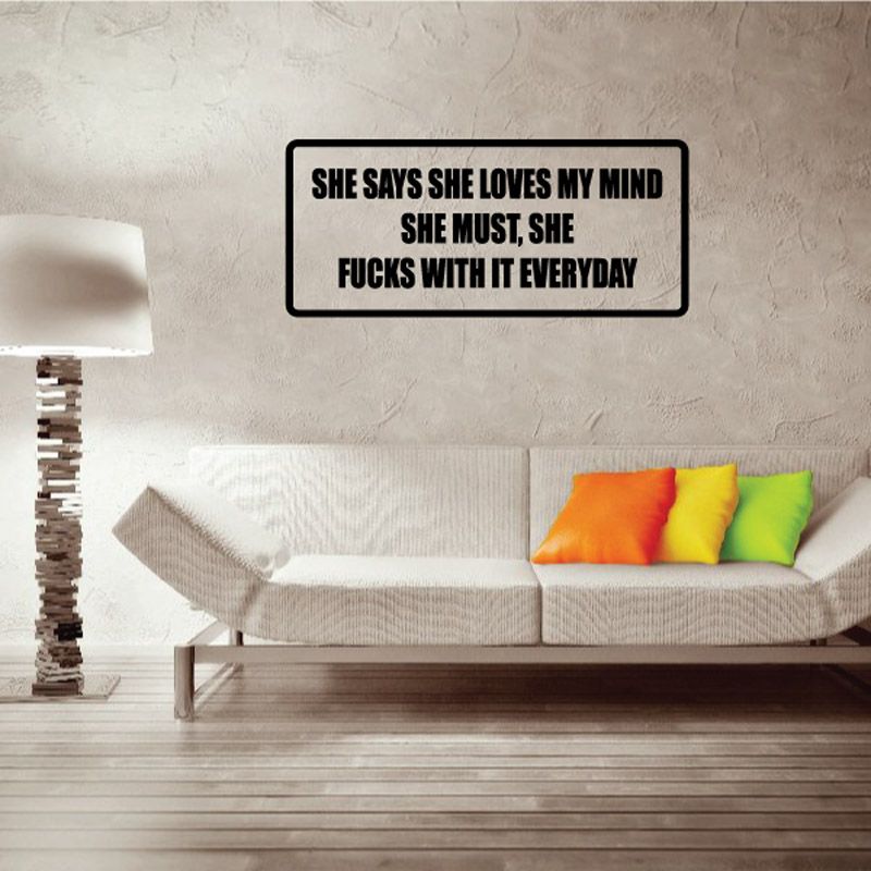 Wall decal, black border with bold text: SHE SAYS SHE LOVES MY MIND