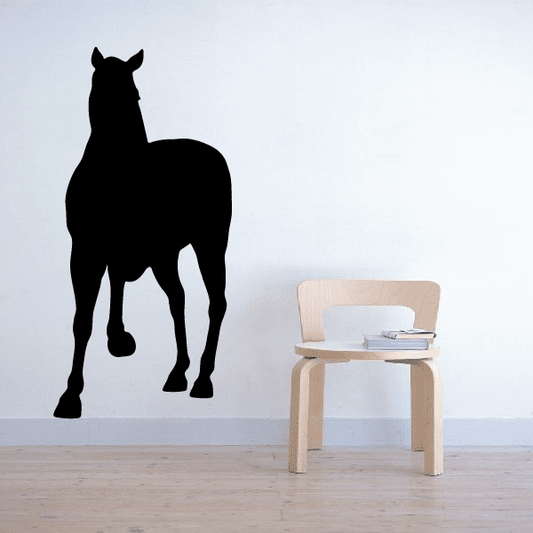 Pony silhouette decal in a shy standing pose, matte black outline design