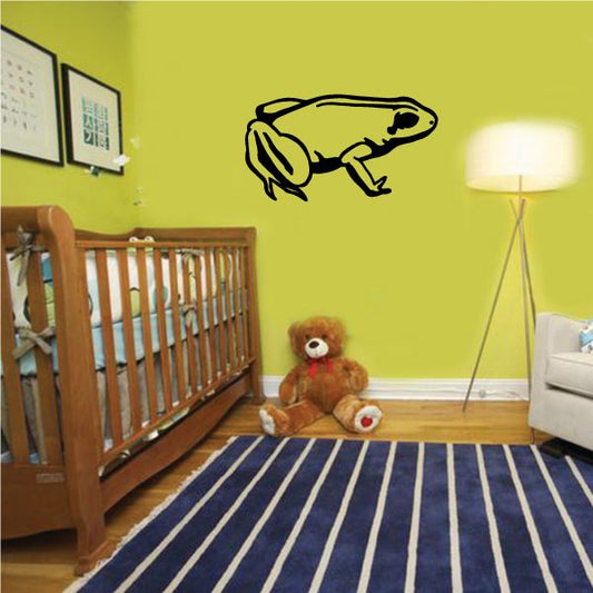 Side-sitting frog wall decal in yellow with black outline