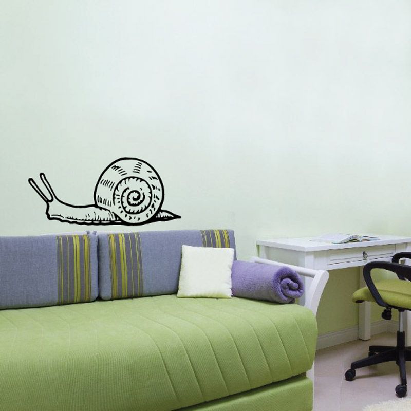 Snail wall decal with outlined spiral shell on a simple body, black and white.