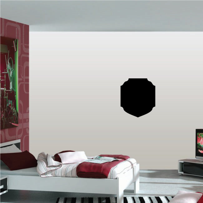 Black shield-shaped wall decal