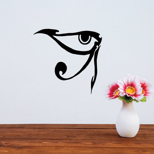 Black eye wall decal with curved lashes and small spiral accents