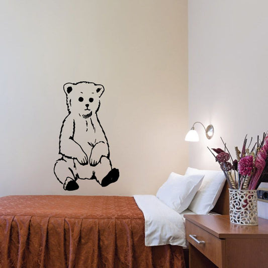 Sitting bear cub wall decal in black line art, seated