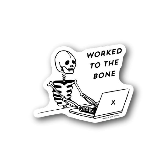 Vinyl laptop sticker: cartoon skeleton typing with 'worked to the bone' lettering