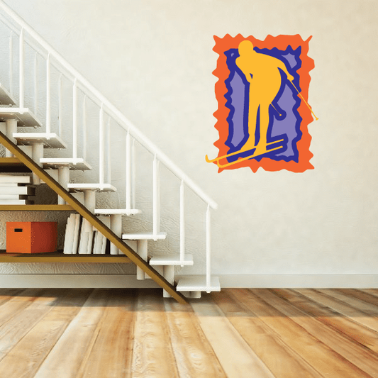 Skiing wall decal sticker with blue and yellow skier silhouette and orange die-cut border