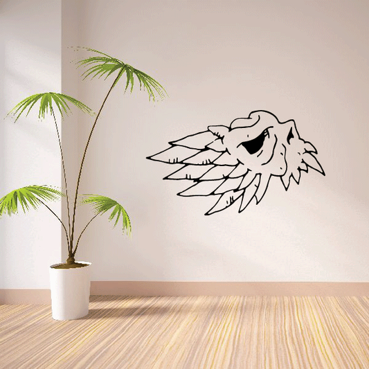 Side winged skull decal, black outline skull with spread wings on white surface