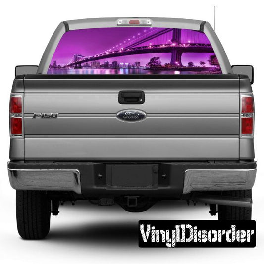 Rear window graphic decal with purple city skyline on pickup truck tailgate view