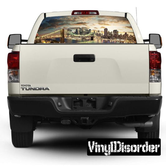 Pickup truck rear window graphic with city skyline view