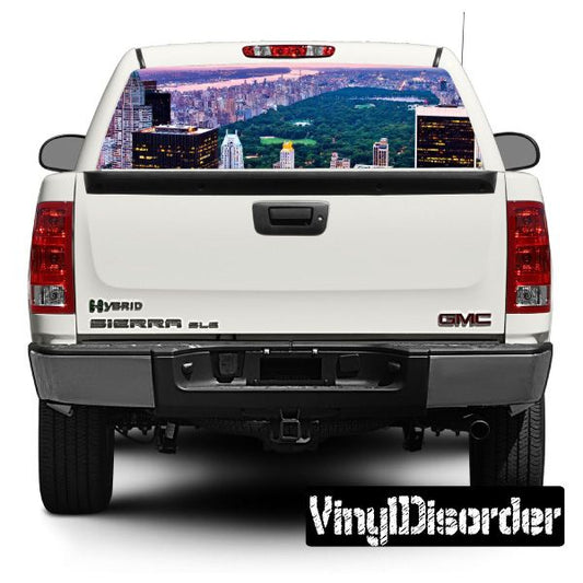 White pickup rear window with colorful city skyline graphic decal