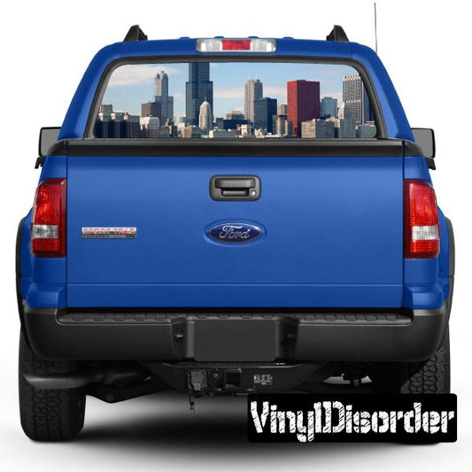 Blue pickup truck rear with Skyline Chicago graphic in rear window